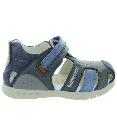 Blue closed toe sandals for a boy wiith ankle support 