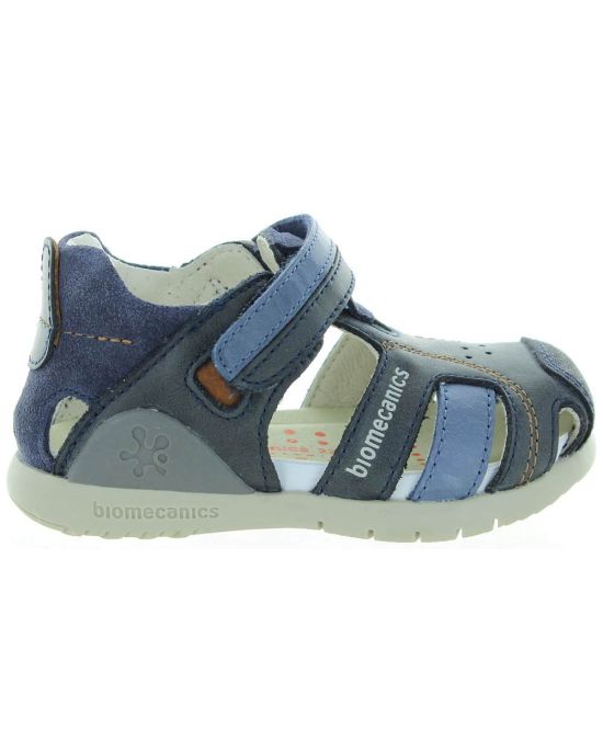 Blue closed toe sandals for a boy wiith ankle support 