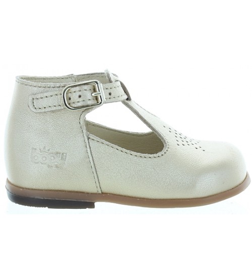 Gold leather dress shoes for a baby