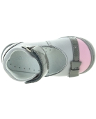 Special gray shoes for a toddler girl with high arches