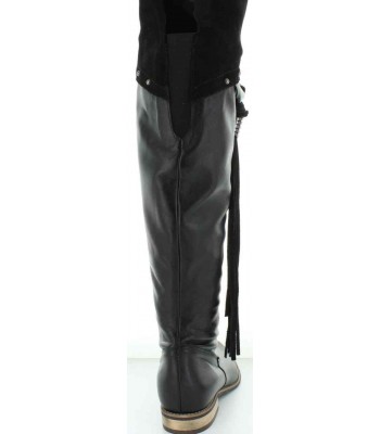Boots that stretch over the knees that are tall and black 